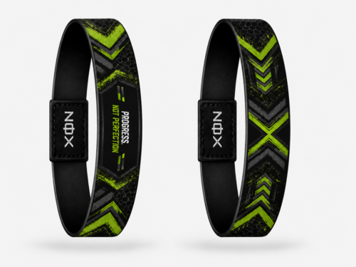 XOIN Progress Not Perfection Premium Wristband featuring black and neon green motivational design