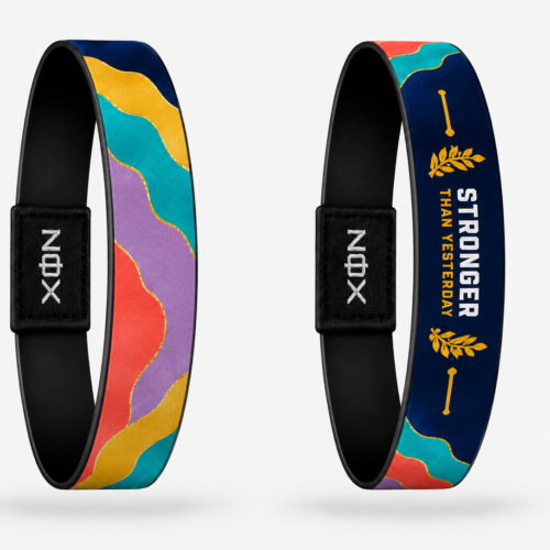 XOIN Stronger Than Yesterday Premium Wristband featuring colorful artwork and motivational message