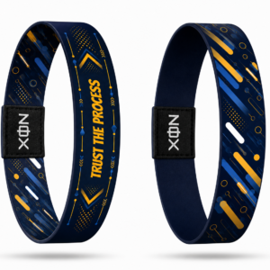 XOIN Trust The Process Premium Wristband featuring blue and gold motivational design